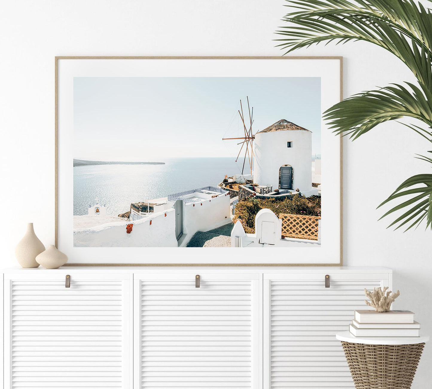 Fine art Santorini wall print framed, highlighting the sunlit blue and white Greek island architecture