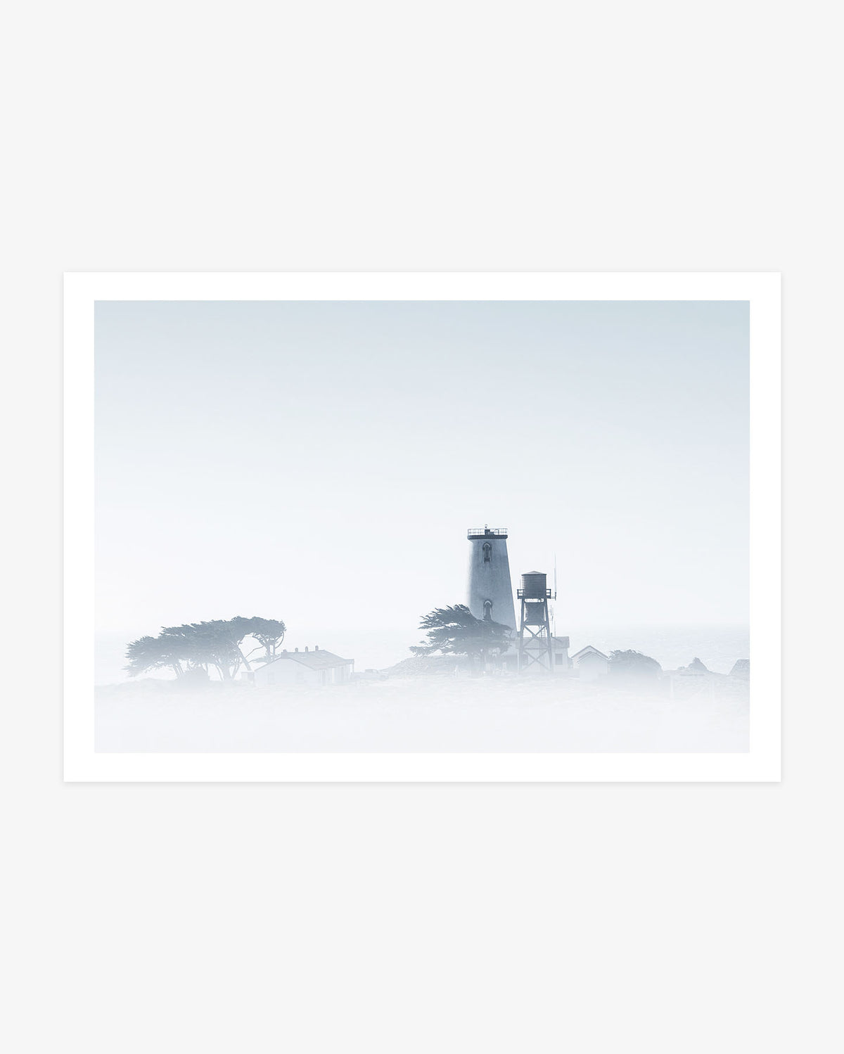 Piedras Blancas Lighthouse photography featuring the historic Las Barcas Lighthouse and surrounding buildings emerging through dense Central California coastal fog.