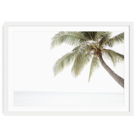 Minimalist palm tree wall art with neutral tones and soft tropical beach sky, modern coastal fine art print available framed or unframed.