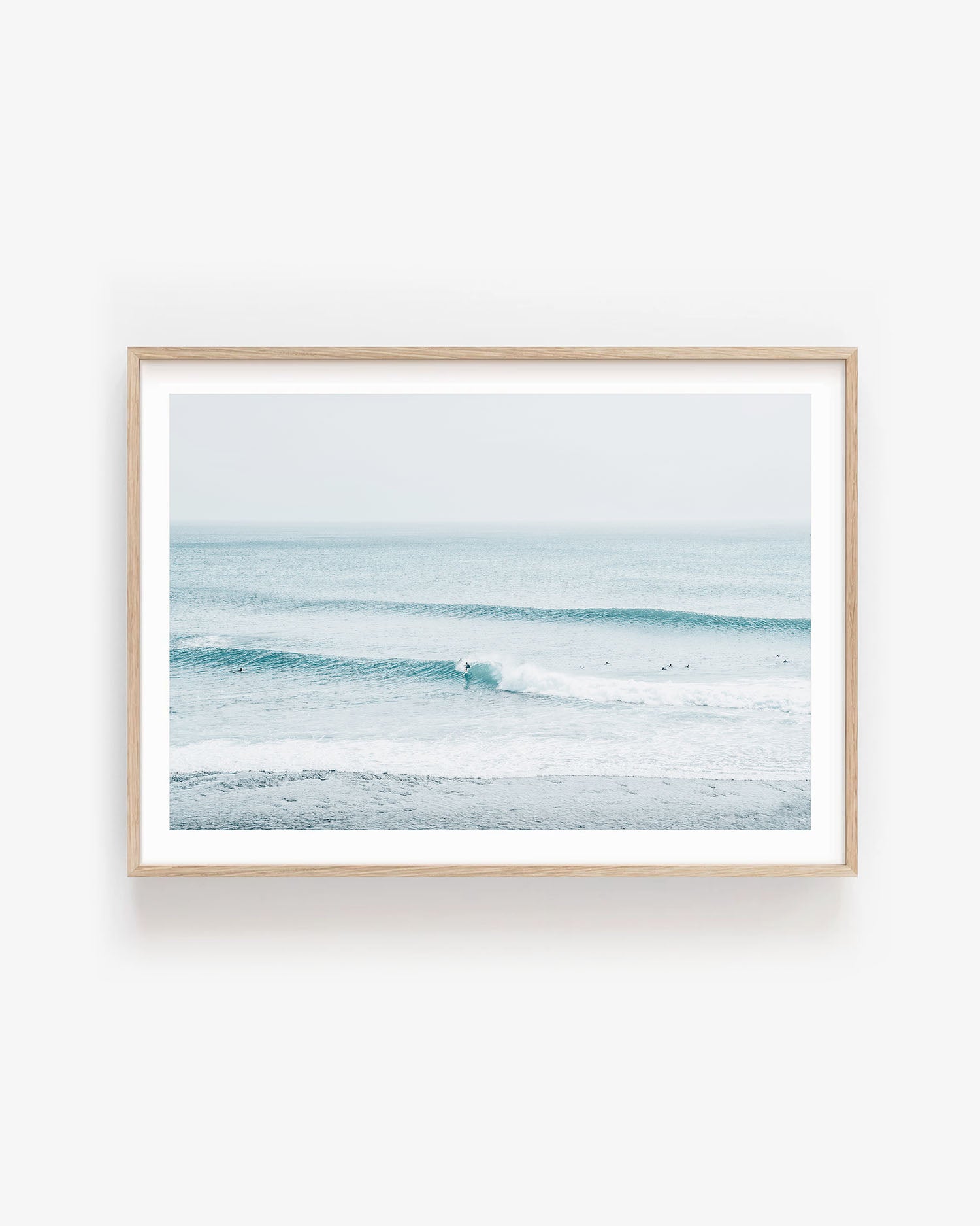 Fine art photo of soft blue ocean waves gently rolling to shore, capturing a peaceful coastal atmosphere; ideal wall art for relaxed, coastal grandmother decor.