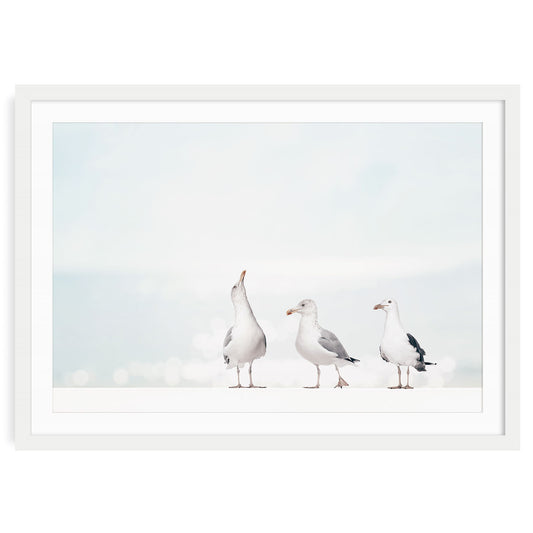 Three seagulls standing on the beach in soft neutral tones wall art print