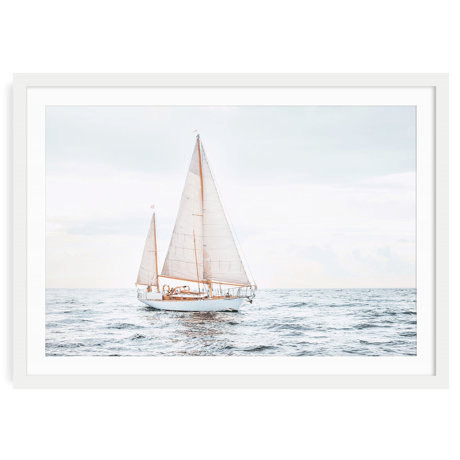 Oversized sailboat art print in modern wooden frame on plain background, minimalist coastal wall decor for beach or lake house.