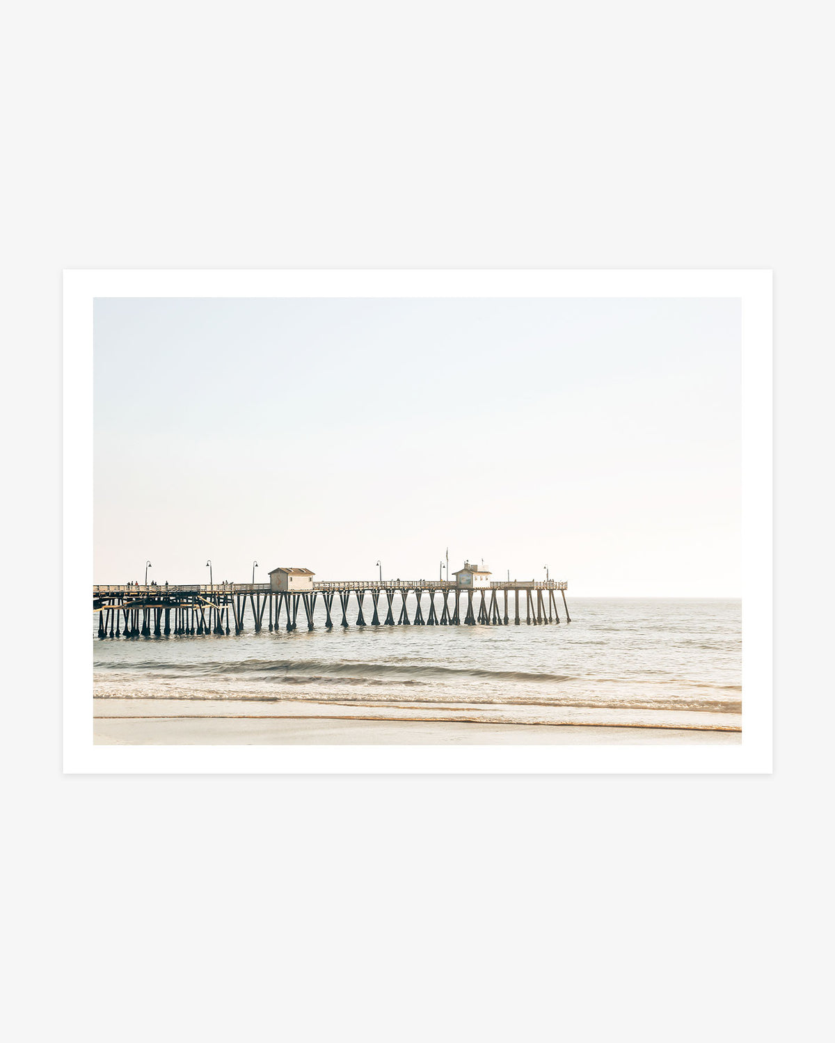 San Clemente Pier wall art featuring the wooden pier extending above gentle Pacific waves in warm, sunlit coastal tones.