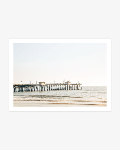 San Clemente Pier wall art featuring the wooden pier extending above gentle Pacific waves in warm, sunlit coastal tones.