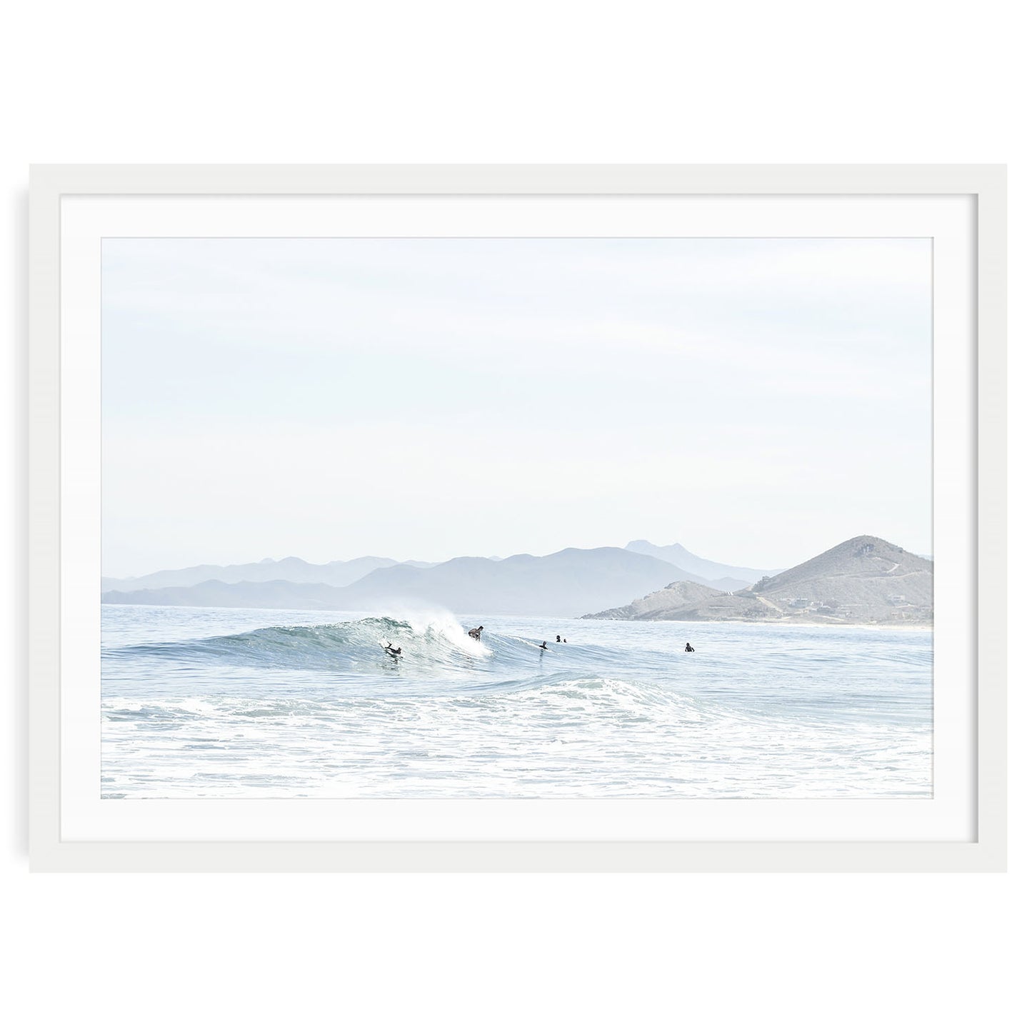 Minimalist ocean surf wall art print showing a soft wave breaking on a sandy beach in Baja California with neutral tones and natural light, framed coastal photo decor