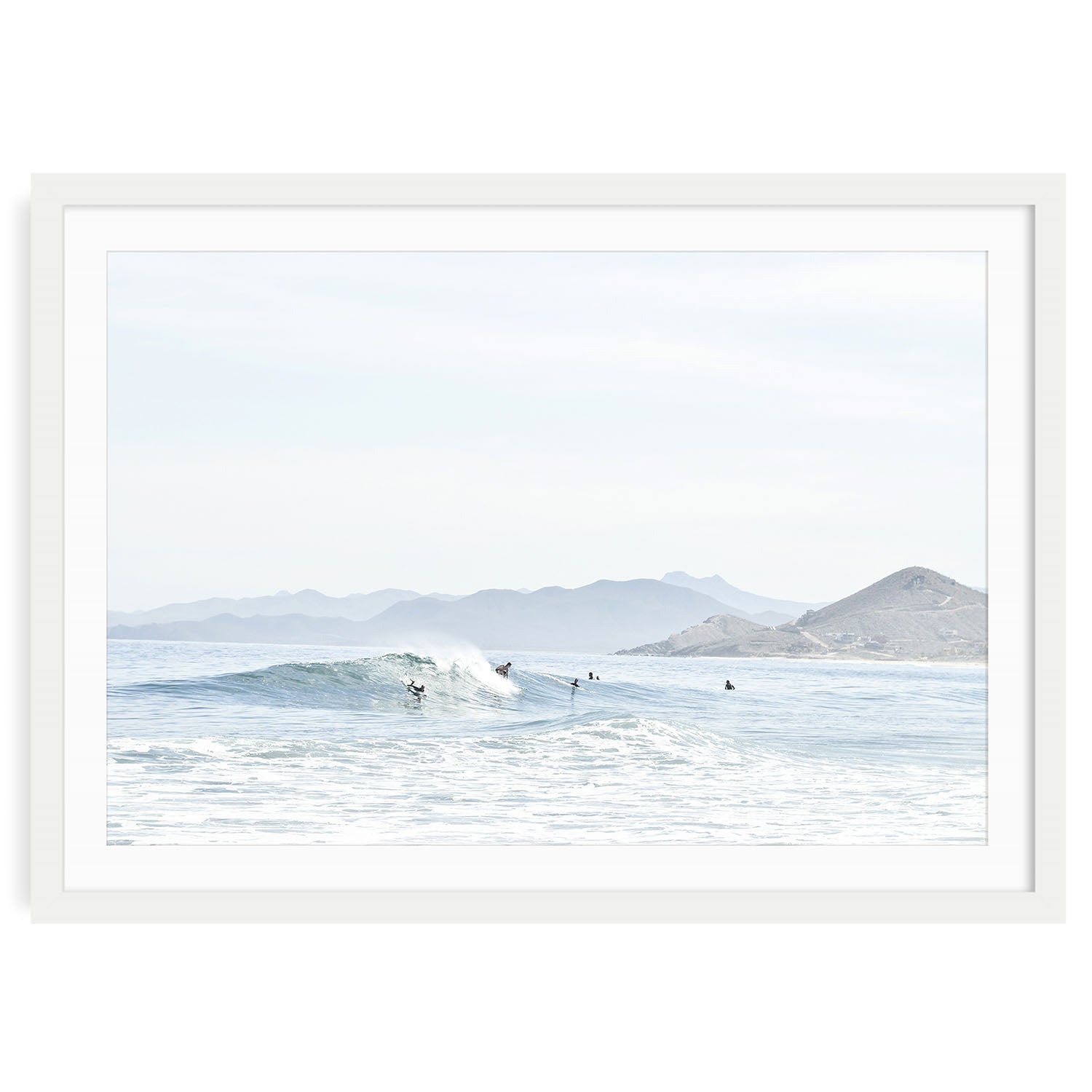 Minimalist ocean surf wall art print showing a soft wave breaking on a sandy beach in Baja California with neutral tones and natural light, framed coastal photo decor