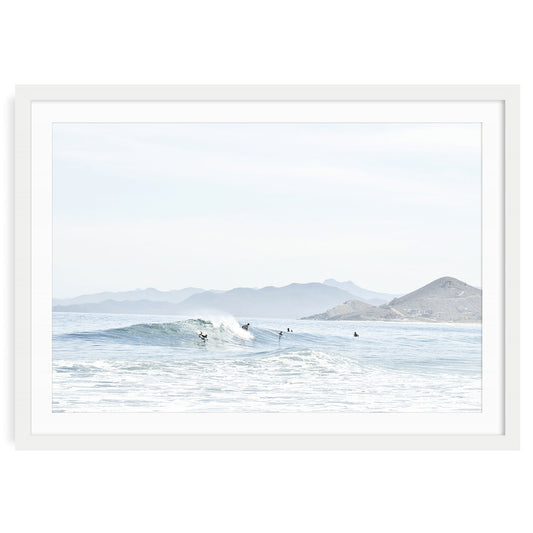 Minimalist ocean surf wall art print showing a soft wave breaking on a sandy beach in Baja California with neutral tones and natural light, framed coastal photo decor