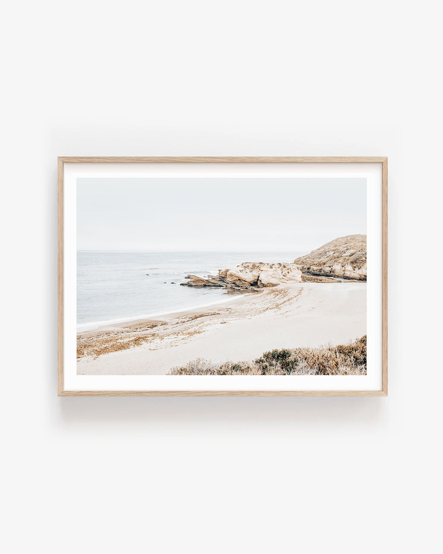 Minimalist Montaña de Oro beach print featuring soft ocean waves and coastal cliffs, neutral tones for modern minimalist wall decor