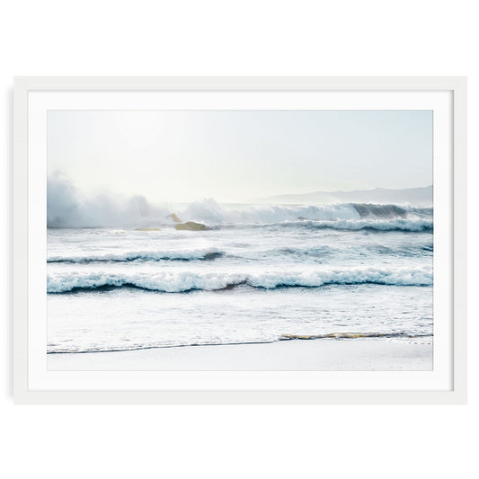 Crashing ocean waves with white seafoam on the shore of Santa Monica beach under soft light, minimalist coastal wall art in calming blue and white tones