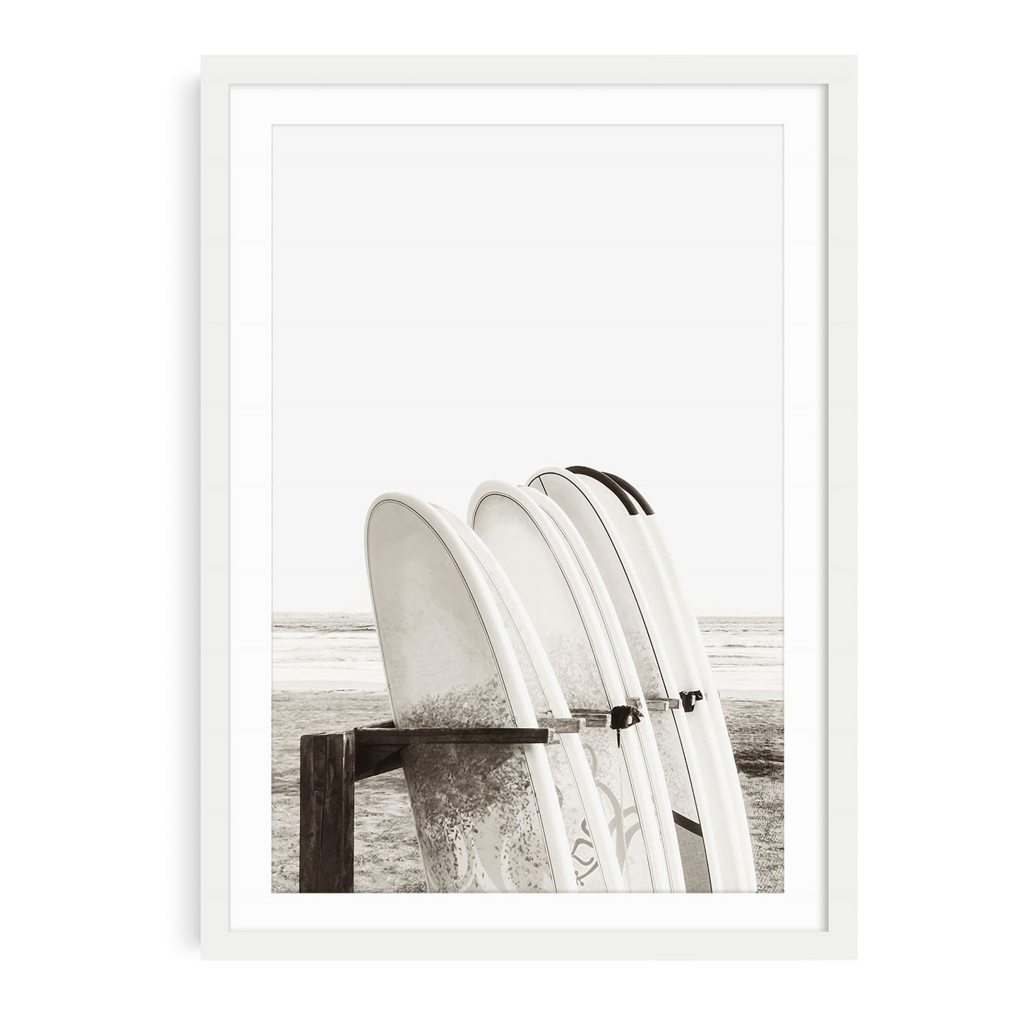 Minimalist beach wall art featuring multiple surfboards organized in a wooden surfboard stand near the sand with neutral beige tones and soft coastal lighting.