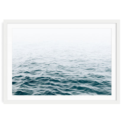 Minimalist ocean wave print featuring blue water movement and soft sea foam under natural light, modern coastal wall art for beach house or nautical decor.