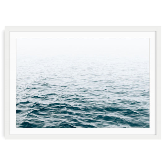 Minimalist ocean wave print featuring blue water movement and soft sea foam under natural light, modern coastal wall art for beach house or nautical decor.