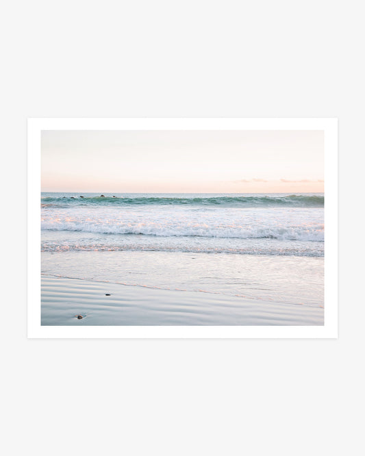 Dana Point beach wall art featuring gentle Pacific waves, reflective wet sand and a soft blue and blush morning sky.