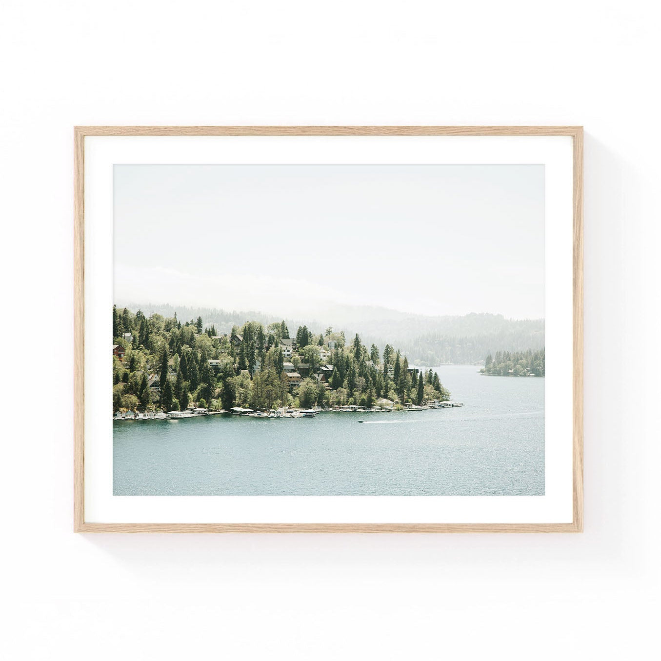 Lake Arrowhead wall art featuring a peaceful mountain lake, pine-covered shoreline, lakeside cabins, and soft misty hills in muted natural tones.