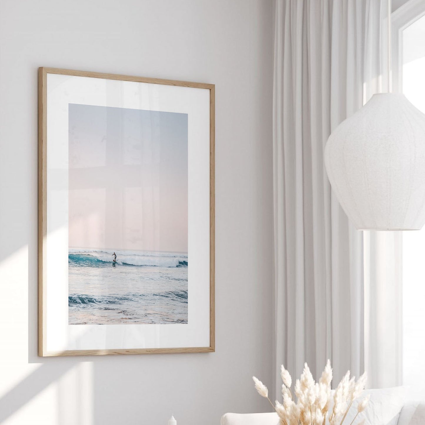Minimalist surfer coastal photography print in a modern fine art frame.