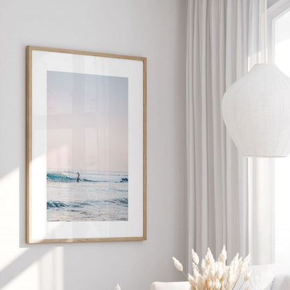 Minimalist surfer coastal photography print in a modern fine art frame.