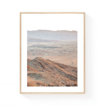 California desert wall art featuring Montezuma Valley's layered mountain ridges and expansive valley floor in soft neutral tones and warm evening light.