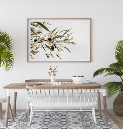 Olive branch minimalist wall art print displayed in a modern dining room setting