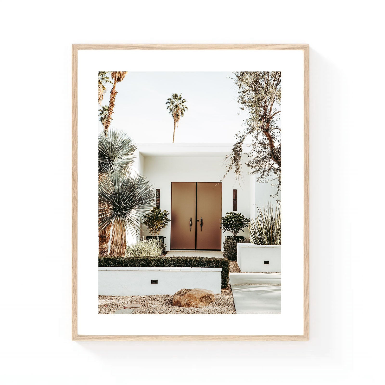 Palm Springs front door wall art featuring a modern desert home entrance with bronze doors, sculptural desert plants, and tall palm trees in soft neutral tones.