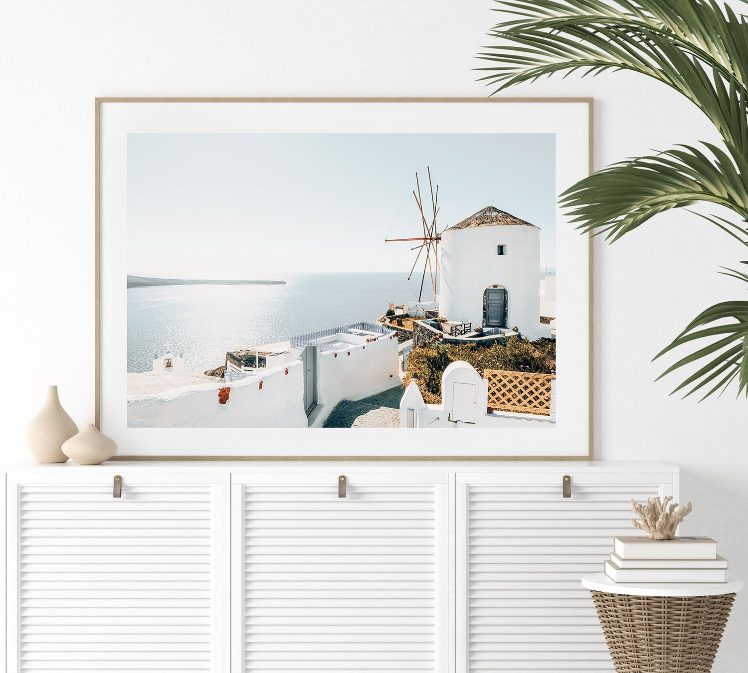 Fine art Santorini wall print framed, highlighting the sunlit blue and white Greek island architecture
