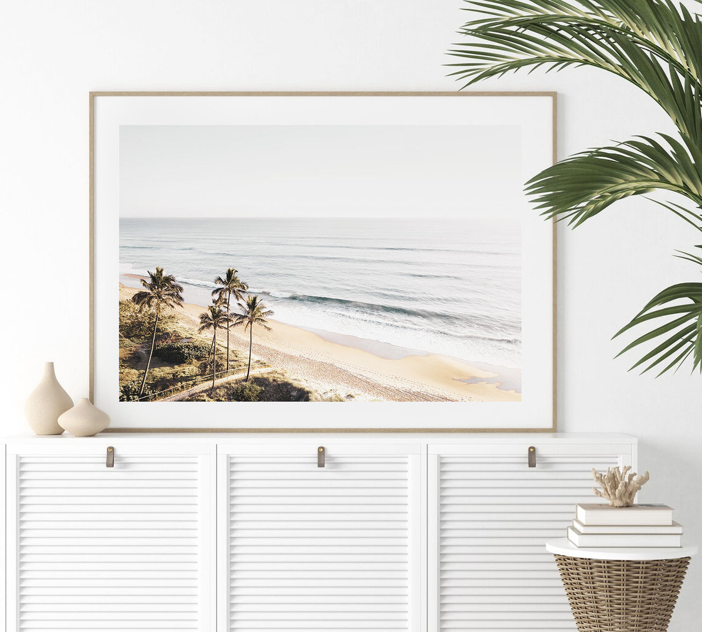 Framed tropical beach wall art showing muted palm and serene ocean horizon